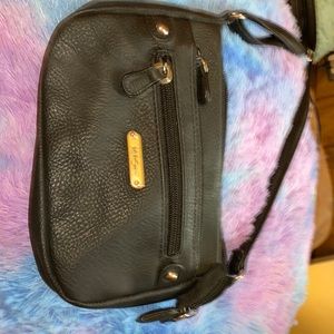 Small black mini long stepped across the shoulder purse